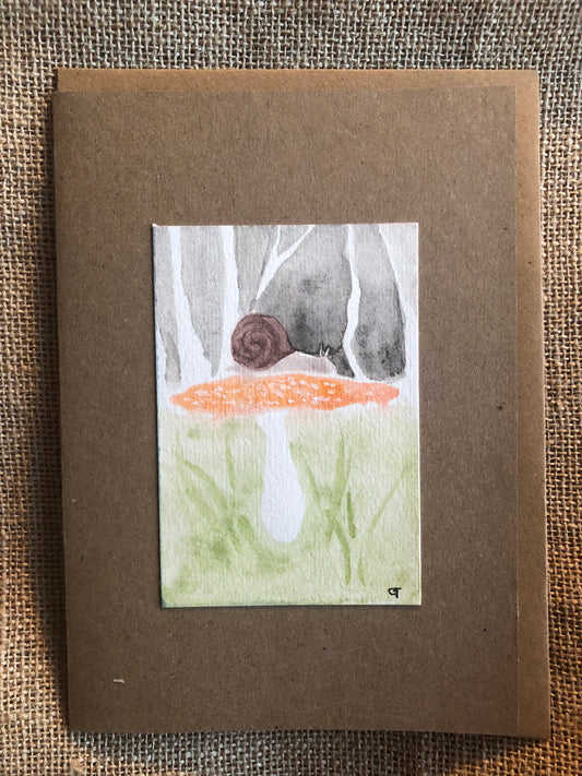 Snail on mushroom, Original watercolour and crystal pigment painting by Gemma Thody. Greeting Card